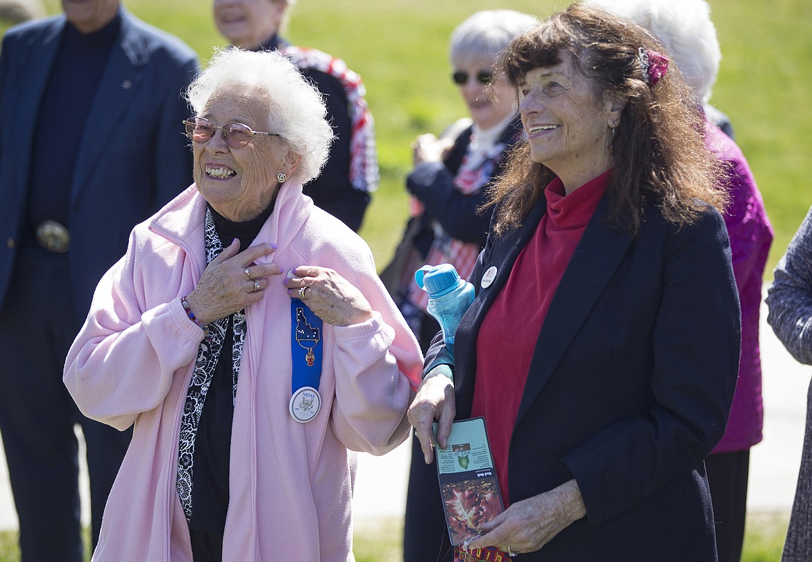 LISA JAMES/Press
Louisa St. John Durking,left, and Jeanice Clinton Roman watch with fellow members of the Lt. George Farragut Chapter of the Daughters of the American Revolution as a 12-foot red oak is planted in McEuen Park in downtown Coeur d&#146;Alene for Arbor Day on Friday.