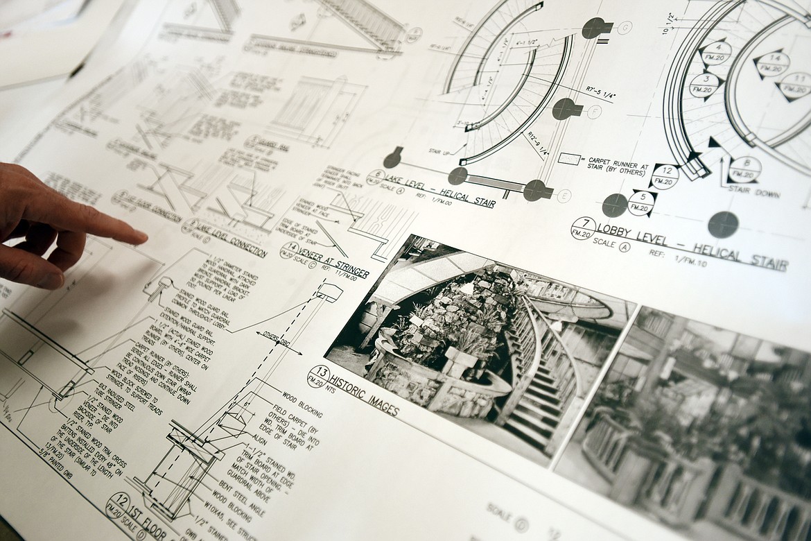 Tony Dawson of Northwest Cabinet Works loks over a copy of the original drawings of the staircase from 1915.