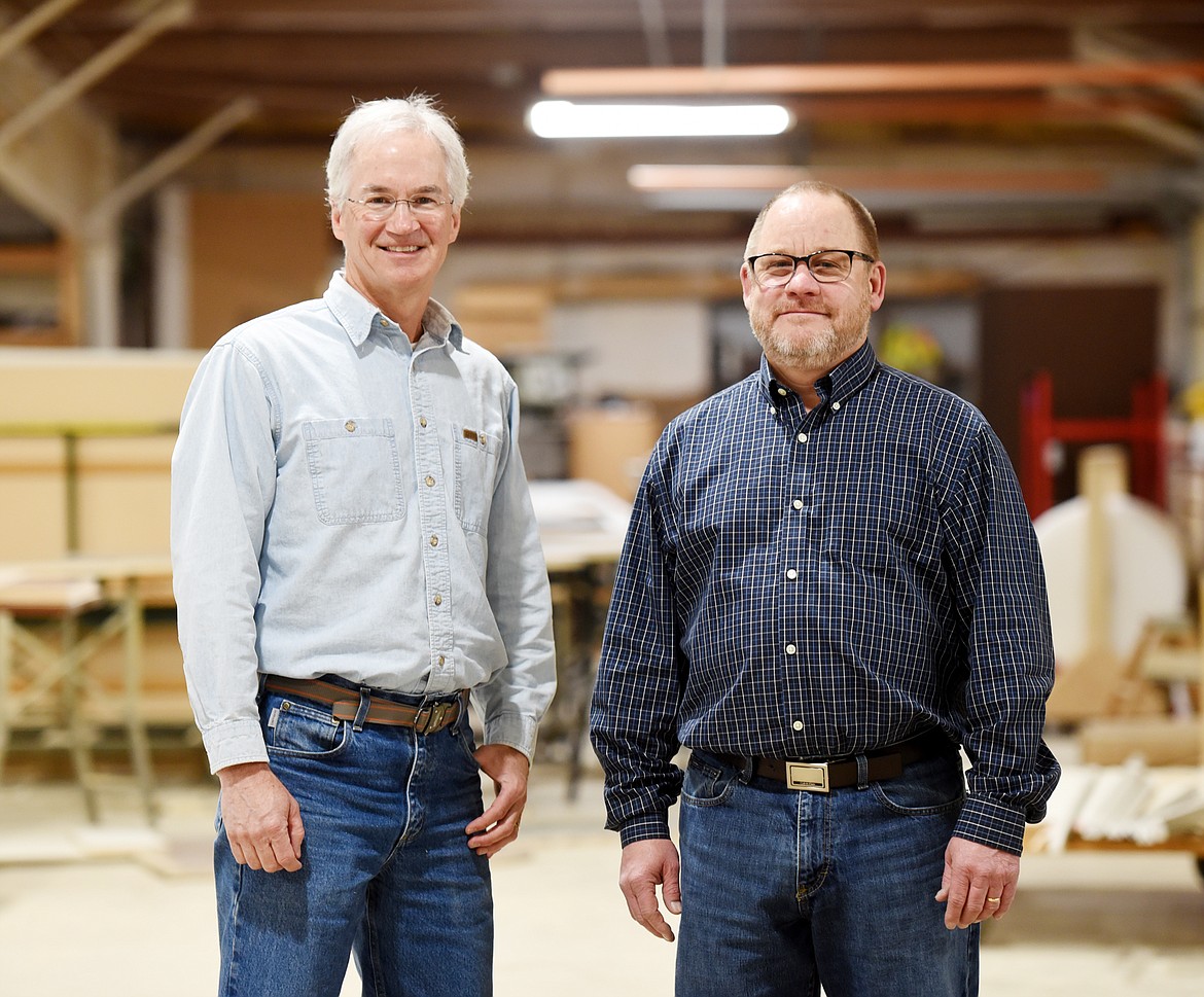 Tony Dawson and John Hale of Northwest Cabinet Works at their shop in Kalispell on April 26. The business was contracted by Swank Enterprises to do build the double-helix spiral staircase at the Many Glacier Hotel.