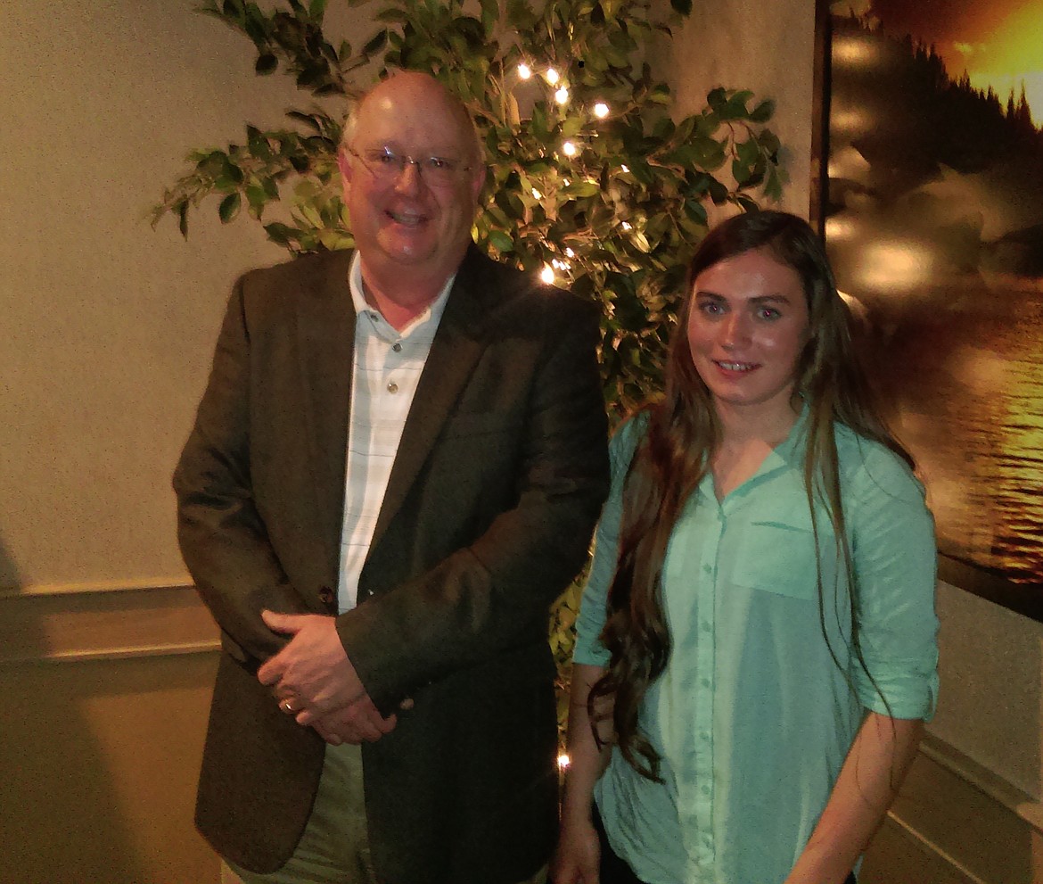 (Courtesy photo)
John Lynn, executive director of the Idaho Athletic Hall of Fame, pictured with Brooke Stevens at the North Idaho Sports Awards Banquet recently in Coeur d&#146;Alene. Stevens, a Clark Fork sophomore three sport athlete who was nominated for high school girls volleyball, was awarded a $1,000 scholarship at the banquet.