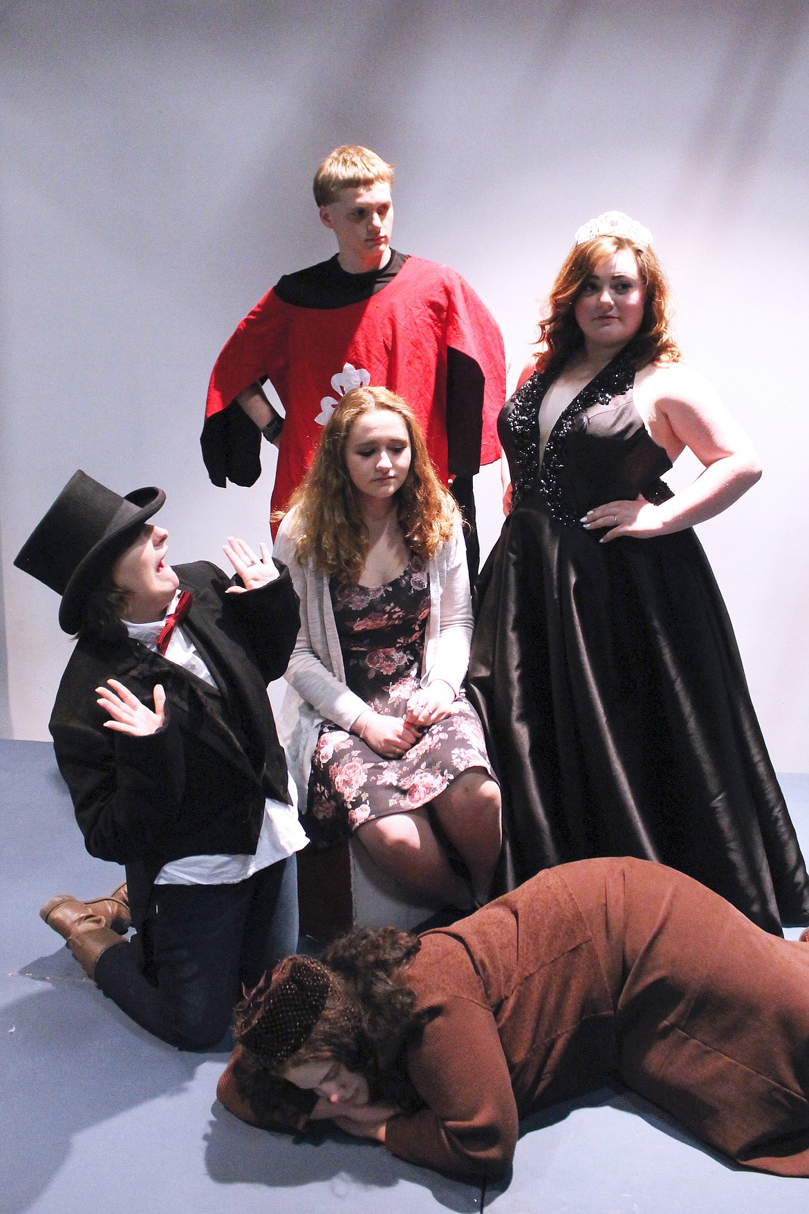 IN FRONT row: Hare (Skye Smith). Middle row (left to right): Mad Hatter (Tessa Ernsperger), Alice (Kenzie White) and Queen of Hearts (Abbey Odell). In back: Soldier (Angelo Sabin).
(Photo courtesy of Glacier High School)