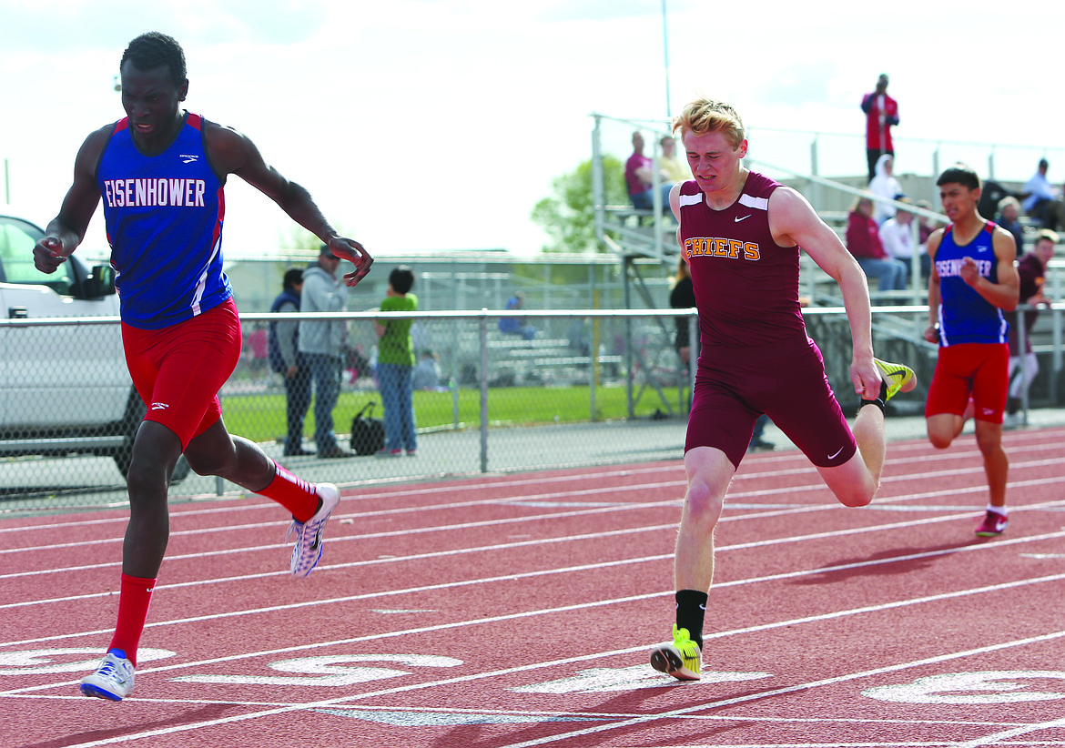 Connor Vanderweyst/Columbia Basin Herald
Eisenhower&#146;s Moise Cook (left) edges Moses Lake&#146;s Joey Robertson in the 400.
