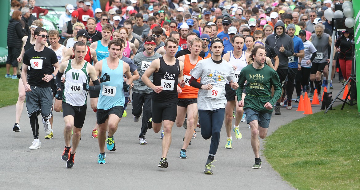 JASON ELLIOTT/File
From left: Andrew Kimpel, Drew Jordan, Toddy Wakefield and Coeur d'Alene resident David Krak lead the pack of 763 competitors in 2017 in the 35th annual Spring Dash race in downtown Coeur d'Alene.