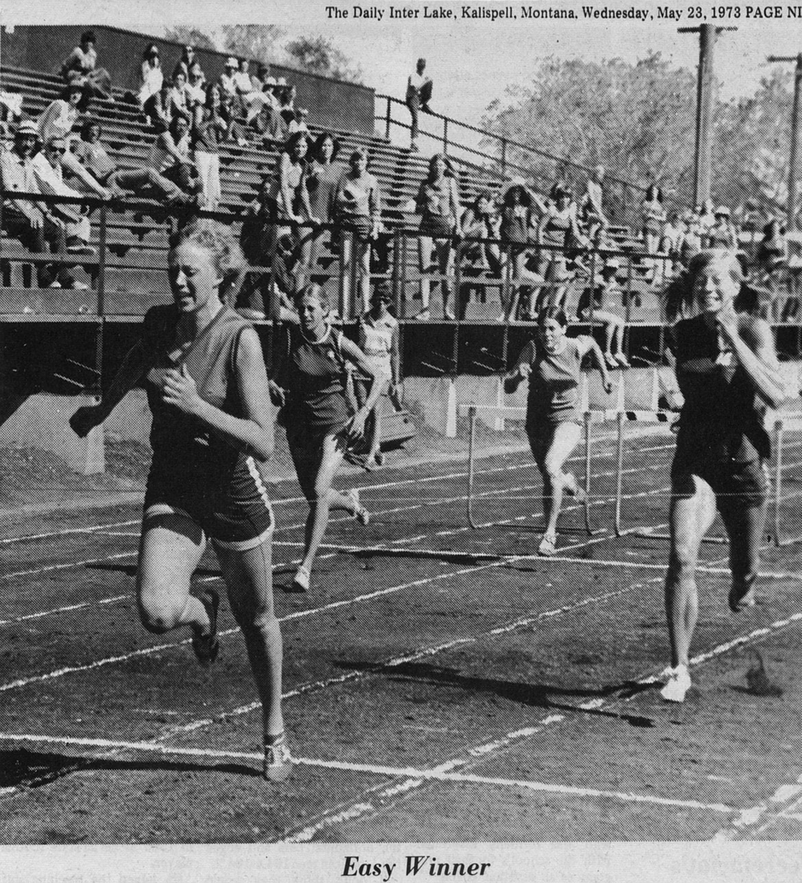 SUE CORNELIUS breaks the tape to win the 100-meter hudles for the Moutainettes in a meet at Rawson Memorial Stadium (now Legends Stadium) in 1973. (Daily Inter Lake, file)