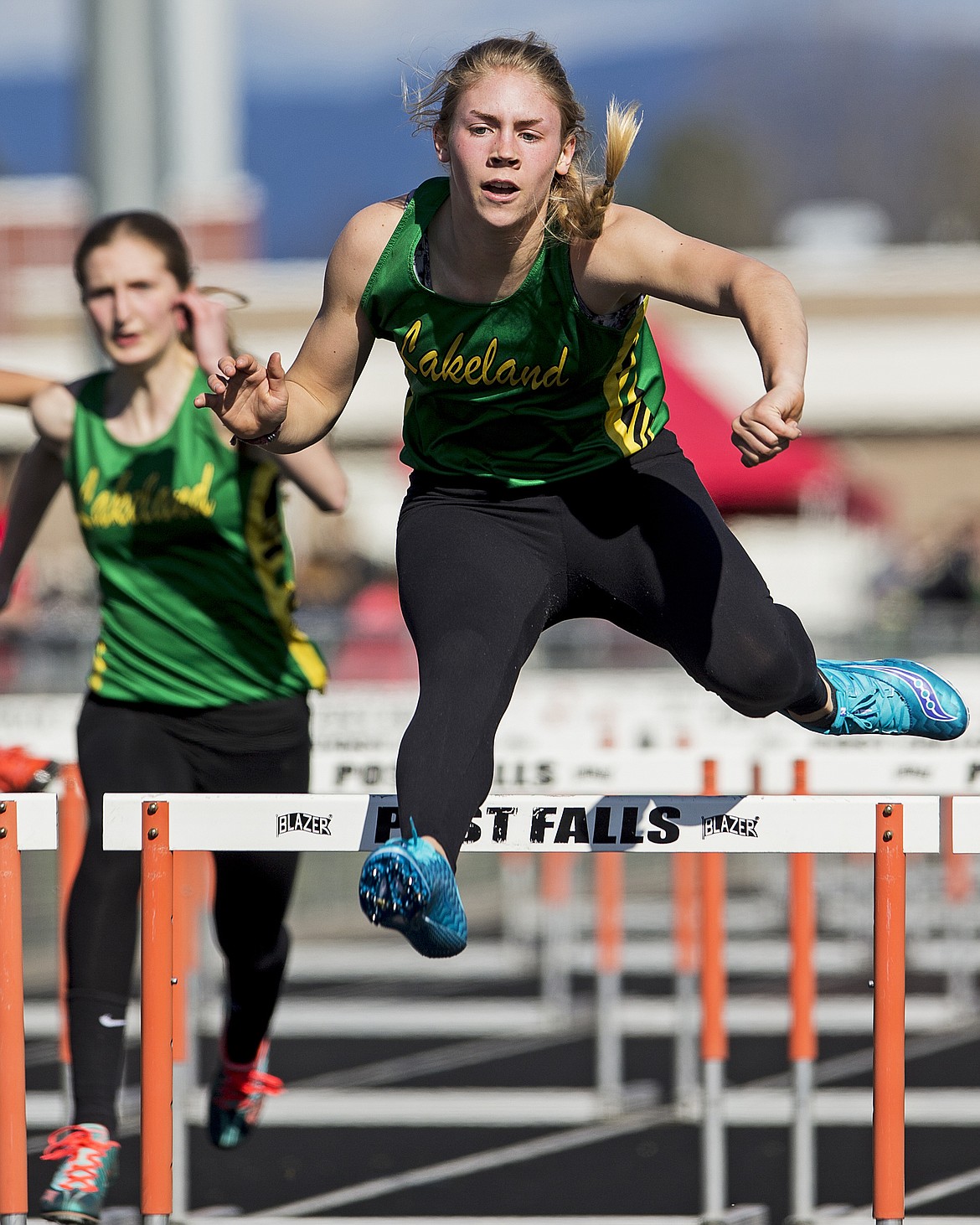 LOREN BENOIT/Press
Lakeland&#146;s Summer Kastning leaps over the final hurdle to finish first in the 100-meter hurdles.