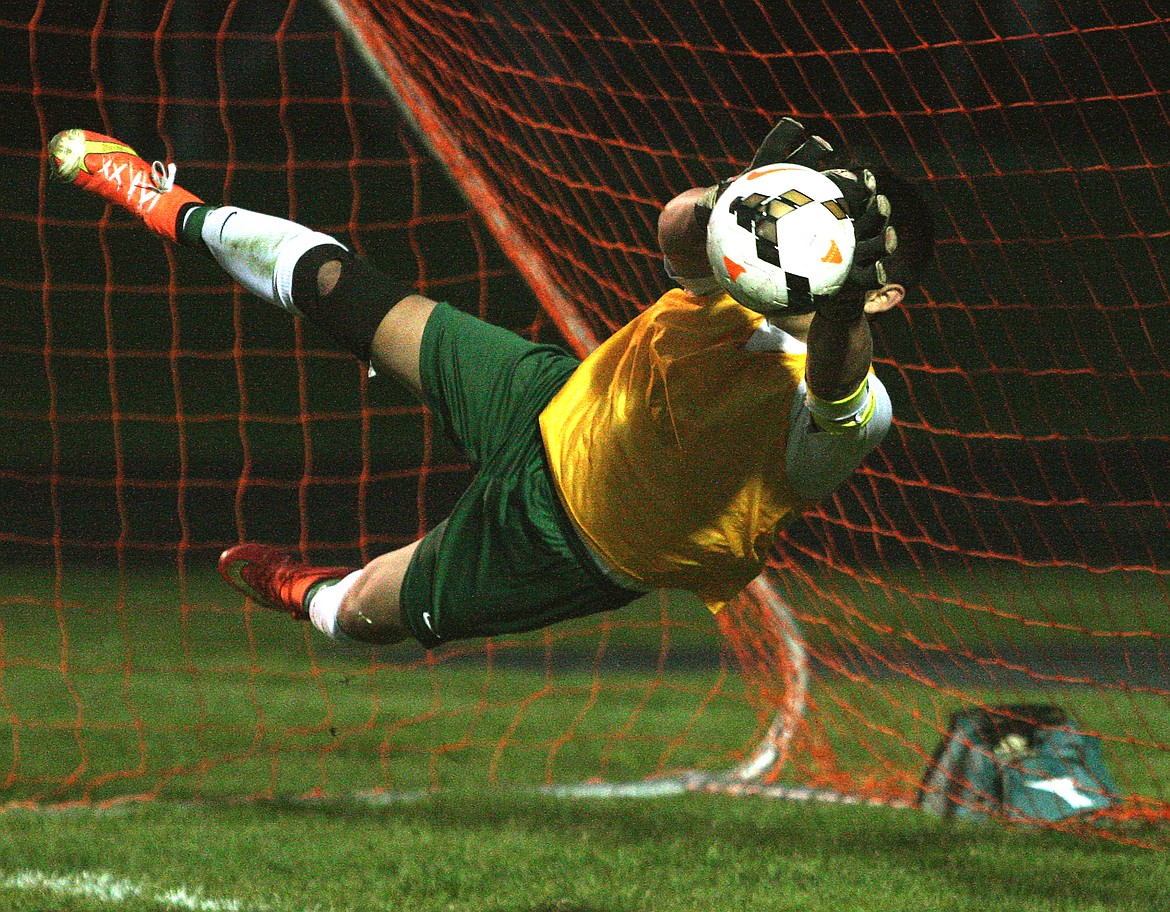 Rodney Harwood/Columbia Basin Herald Quincy goalkeeper Alexis Acevedo dives to his left to make a stop during the shootout against Ephrata Tuesdya night at Jacks Stadium. The Tigers won the CWAC match 3-2.