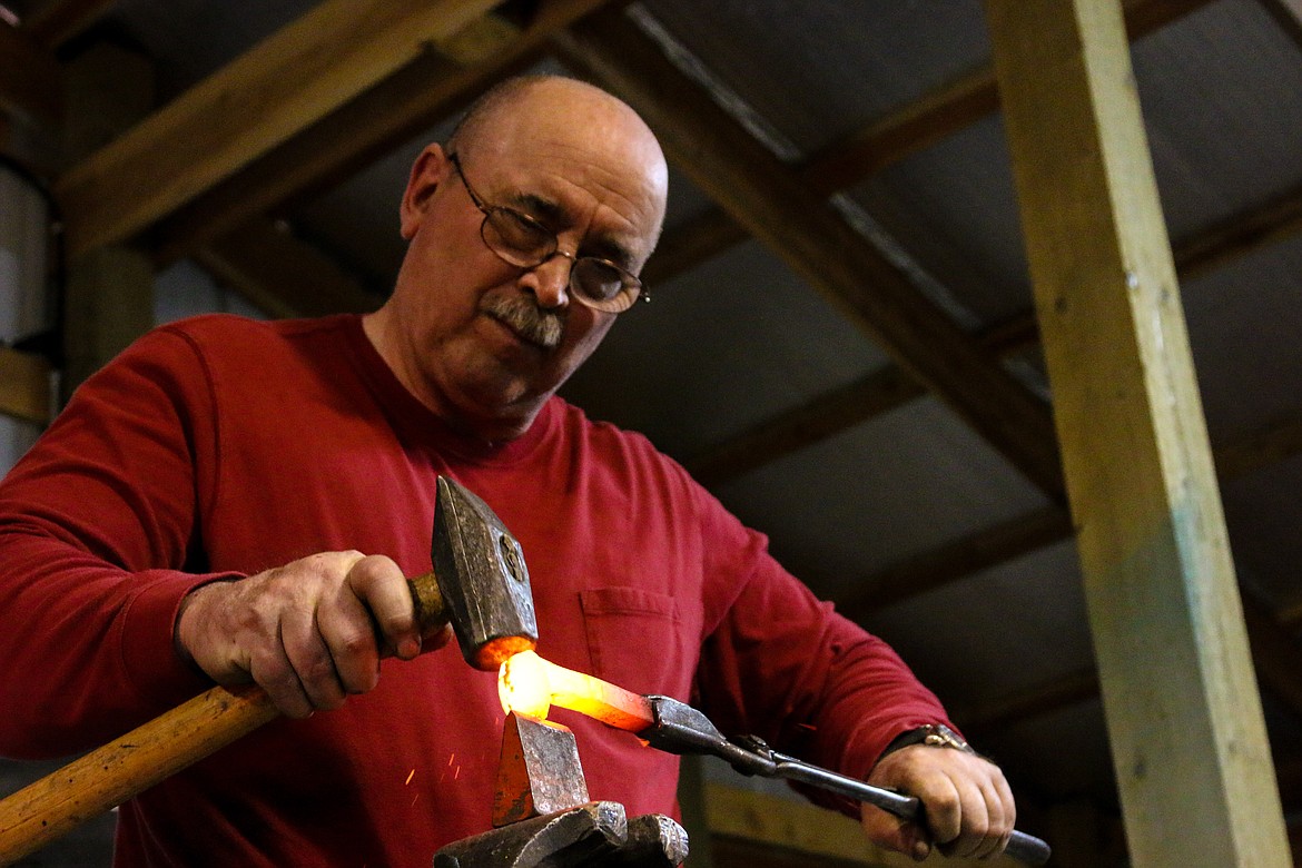 &#151;Photo by MANDI BATEMAN
Blacksmith Grant Marcoux working on a project.