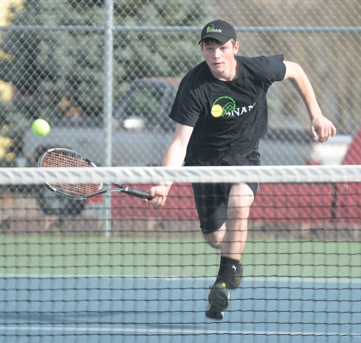 RONAN TENNIS player Coleman Taylor attempts to volley an offering from an opponent in the Libby Invitational Saturday at Libby High School. (Photo courtesy of Jim Blow)