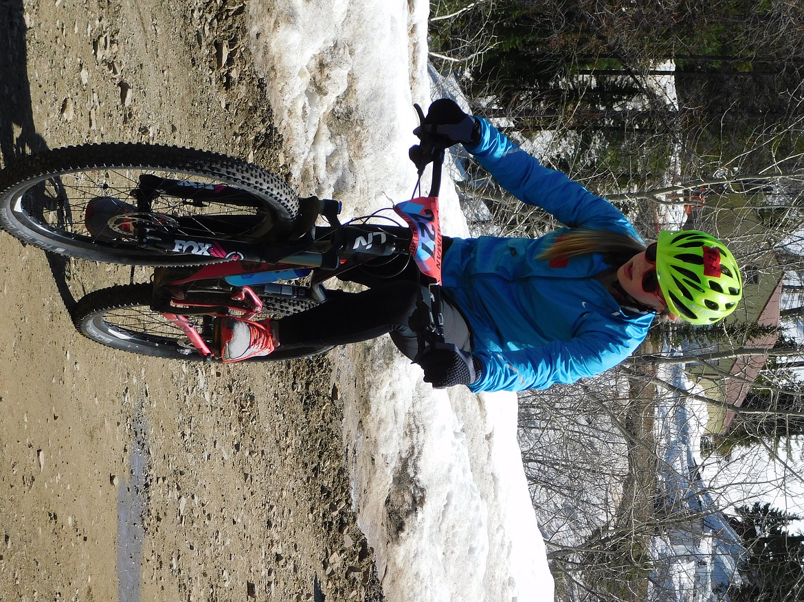 Winner of the kids solo category, Ada Christensen of Couer d Alene takes a deep breath as she begins the bike leg of the 2017 Leadman.&#160;