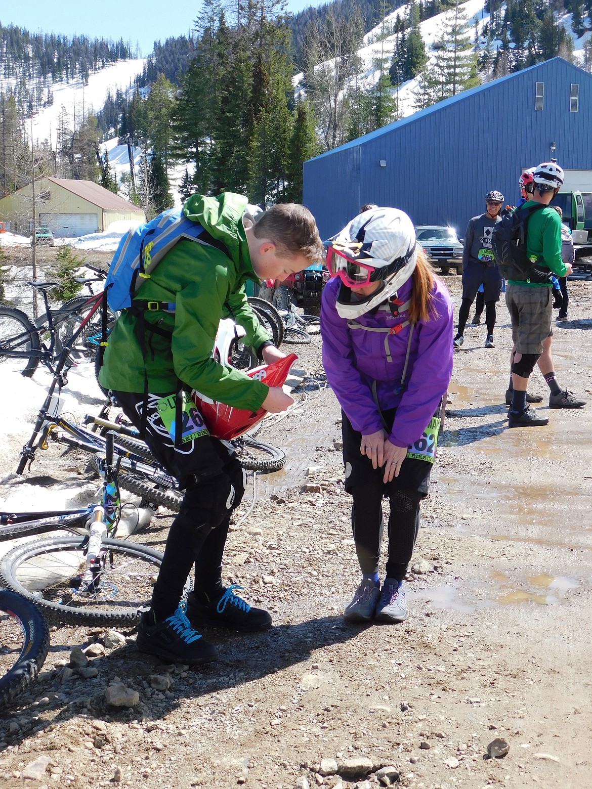 A mother&#146;s work is never done. Stacy Goranson looks on as her son and fellow competitor, gets his helmet ready before the bike leg of Leadman.&#160;