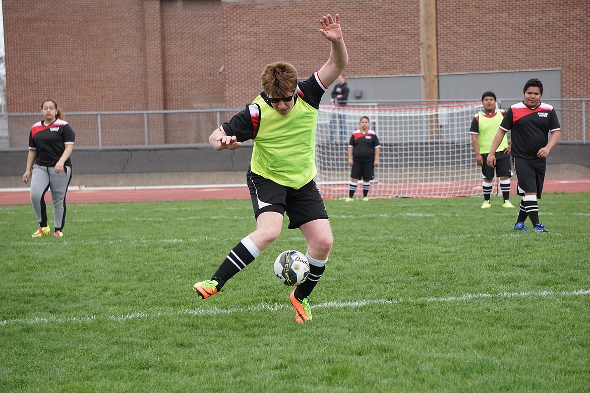 Courtesy photo - Othello&#146;s Josh Lembcke displays some fancy footwork as he sets up for one of his two goals against Quincy.