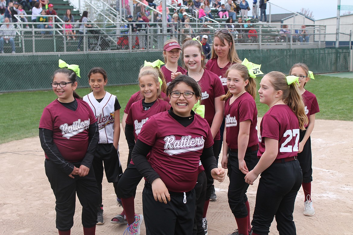 Charles H. Featherstone/Columbia Basin Herald
The Moses Lake Rattlers girls softball team after learning they had won the award for best parade float at the Little League opening ceremony on Saturday. The team won a pizza lunch and frozen yogurt at Blue Palm.
