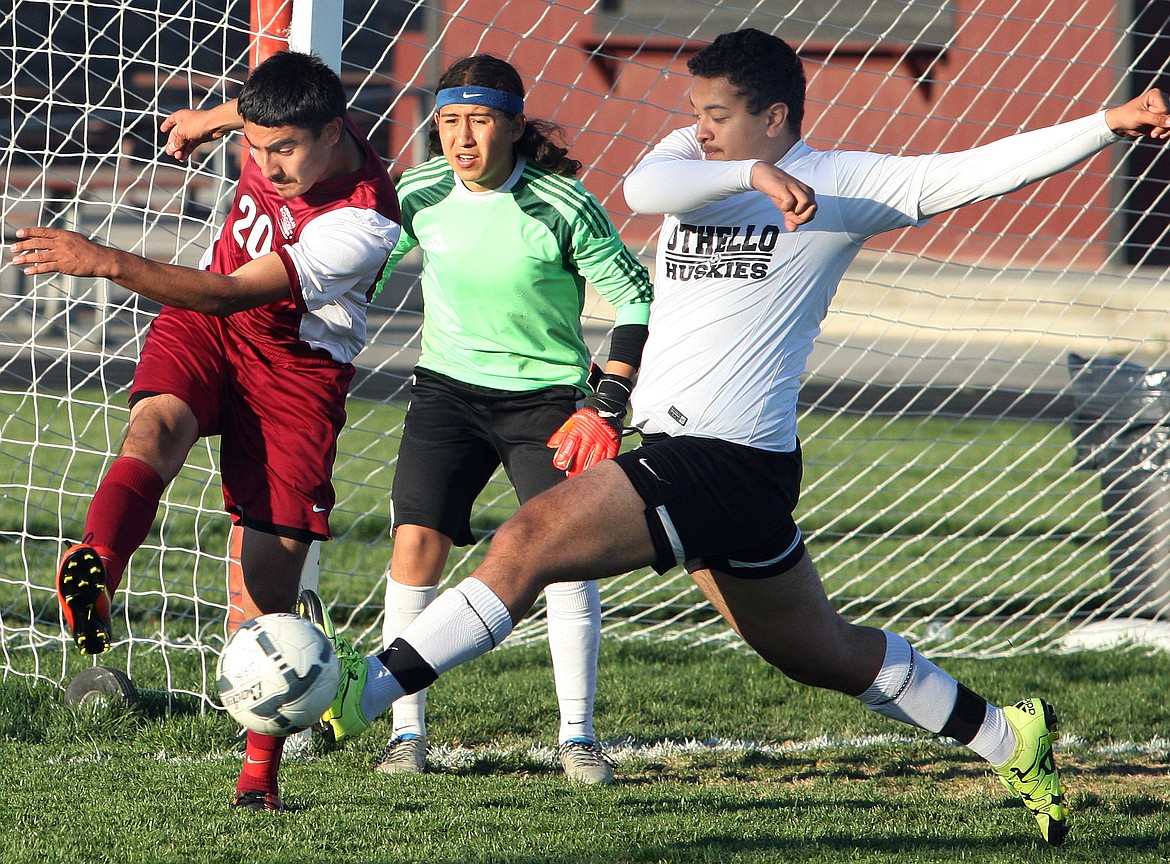 Rodney Harwood/ColumbiaBasin HeraldOthello's Isaac Velasco (7) battles for a ball with Guillermo Aguilera (20) in the Highland box during the first half of Thursday's non-league match.