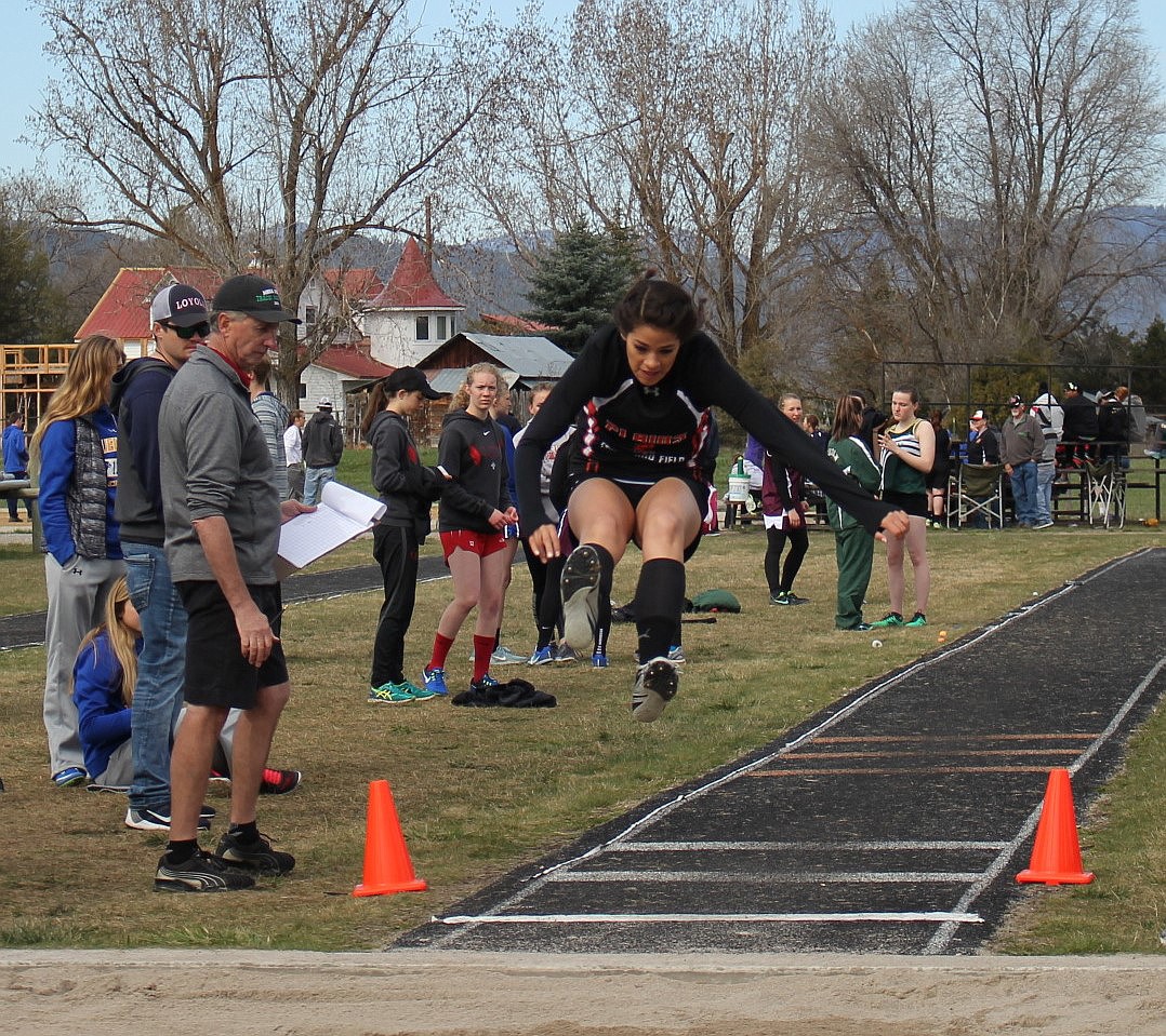 CREE LULACK of Plains competes in the long jump at the Frenchtown track meet.