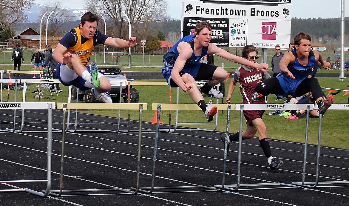 THOMPSON FALLS runner Parker Klaus (left) clears a hurdle during the 110 meter race. (Kathleen Woodford photos/Clark Fork Valley Press)