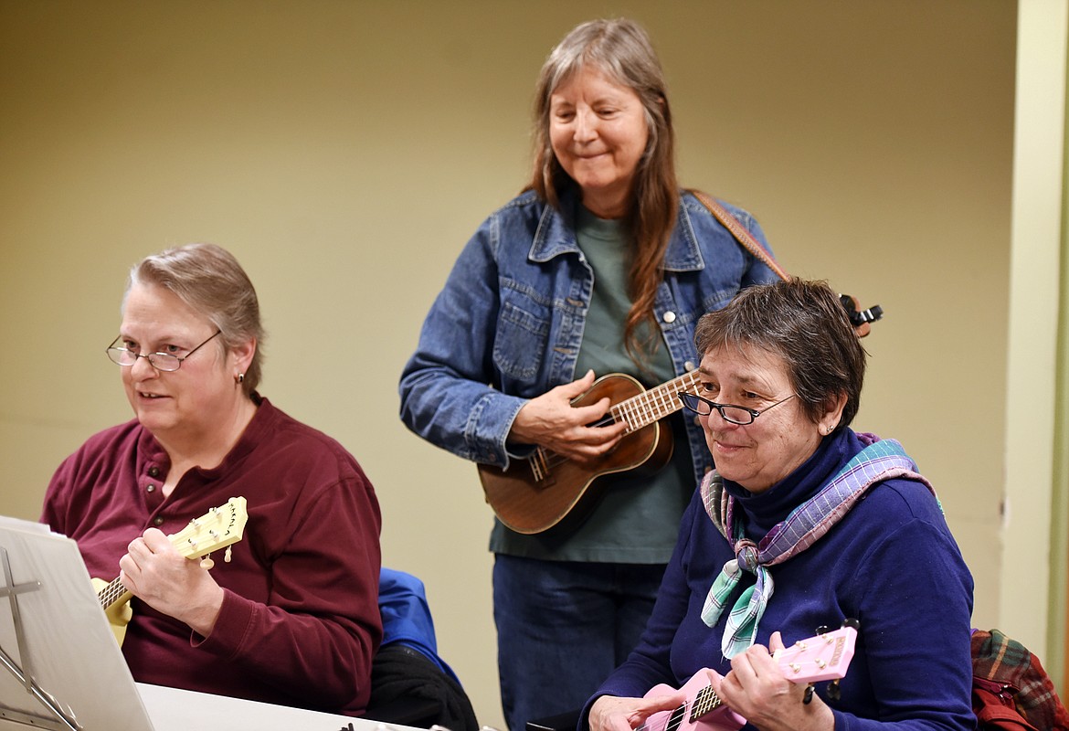 FROM LEFT, Denise Jenke, Linda Christensen, Amery Zedd and members of the Ukulele Strum-Along group practice in the Meeting Room of ImagineIf Library on Tuesday, April 18, in Kalispell.
(Brenda Ahearn/Daily Inter Lake)
