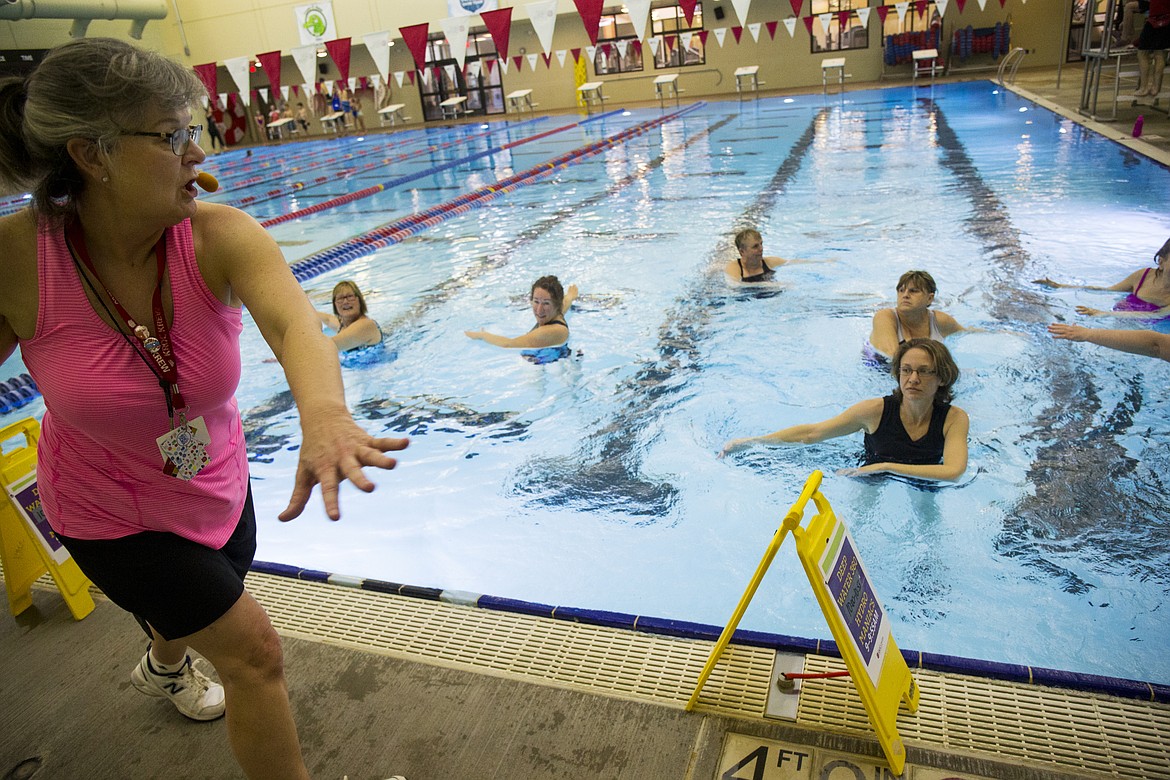 LOREN BENOIT/Press
Multiple sclerosis water class instructor Ruth Kirk leads her class through upper-body exercises Wednesday afternoon at the Kroc Center. Water therapy helps relieve muscle tension, builds functional stability and strengthens core muscles. Classes will expand to three days a week in June.