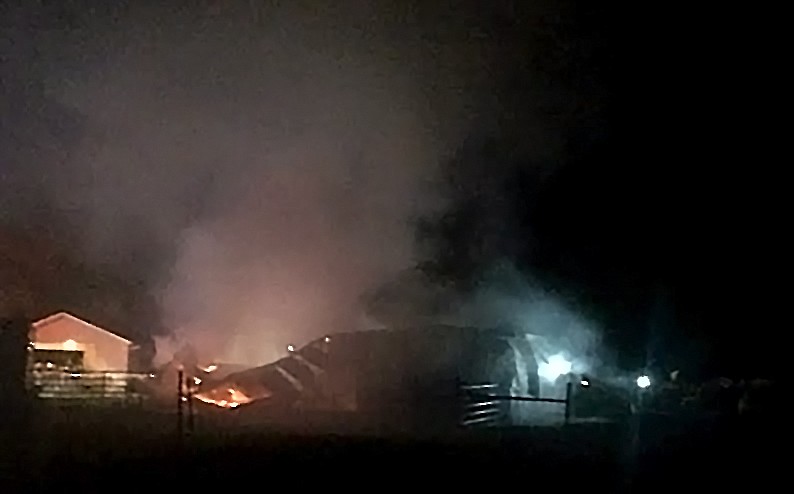 &#151;Photo by STAR SILVA
North Bench firefighters, along with South Boundary Fire Protection District, and Hall Mountain Fire Department respond to a residential barn fire April 12 around midnight on Nighthawk Road.