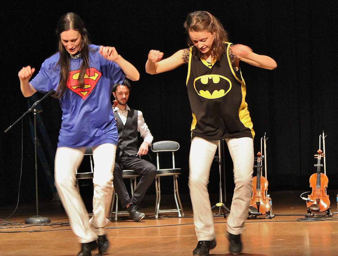 Julie and Kerry Fitzgerald do battle on the dance floor at Monday night&#146;s concert at Wallace High School. They are part of &#147;Everything Fitz,&#148; a Canadian bluegrass fiddle and step dancing group. Their performance was sponsored by Shoshone County Community Concert Association.