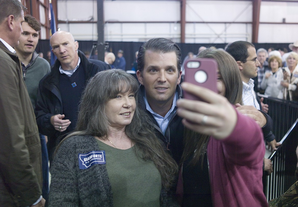 Susan Palmer, left, Donald Trump Jr. and Angel Palmer take a photo together after the rally.