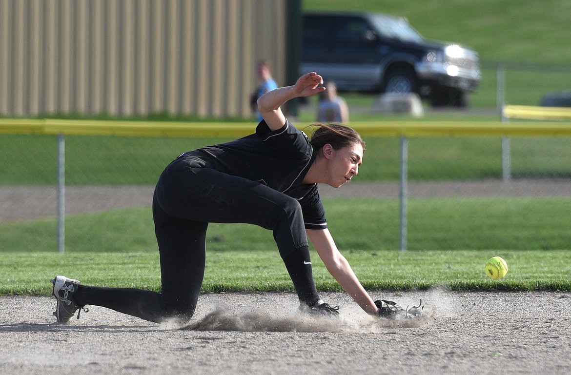 Polson shortstop Kaelyn Smith lunges for a ball just out of reach against Flathead at Kidsports on Tuesday. (Aaric Bryan/Daily Inter Lake)
