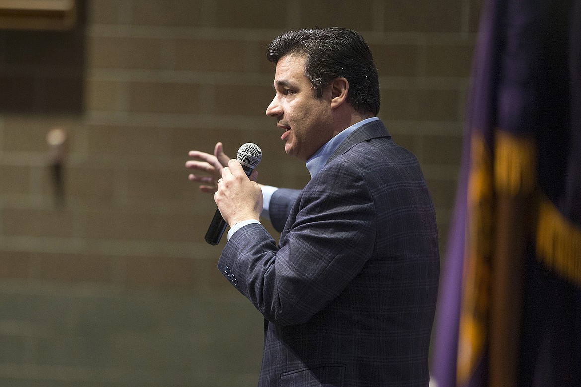 LISA JAMES/PressIdaho Congressman Raul Labrador, (R), greets the audience as he opens his town hall at Lake City High School in Coeur d'Alene on Friday night.