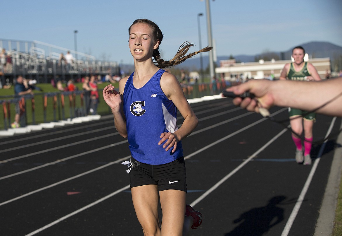 LISA JAMES/Press
Brooklyn Shell of Coeur d'Alene crosses the finish line to help win  the 3200 with a time of 12:21:24 at Post Falls High School on Thursday.