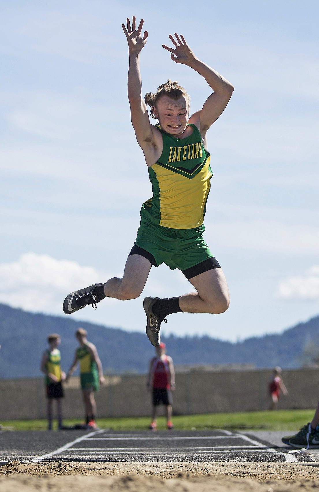 LISA JAMES/Press
Colton Boettcher of Lakeland competes in the long jump at Post Falls High School on Thursday.