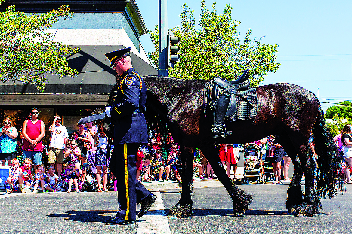 MATT WEIGAND/Press file
The 2015 Fourth of July parade in Coeur d&#146;Alene started on a somber note. In honor of slain police Sgt. Greg Moore, a riderless horse was led down the parade route by a Coeur d&#146;Alene police officer.