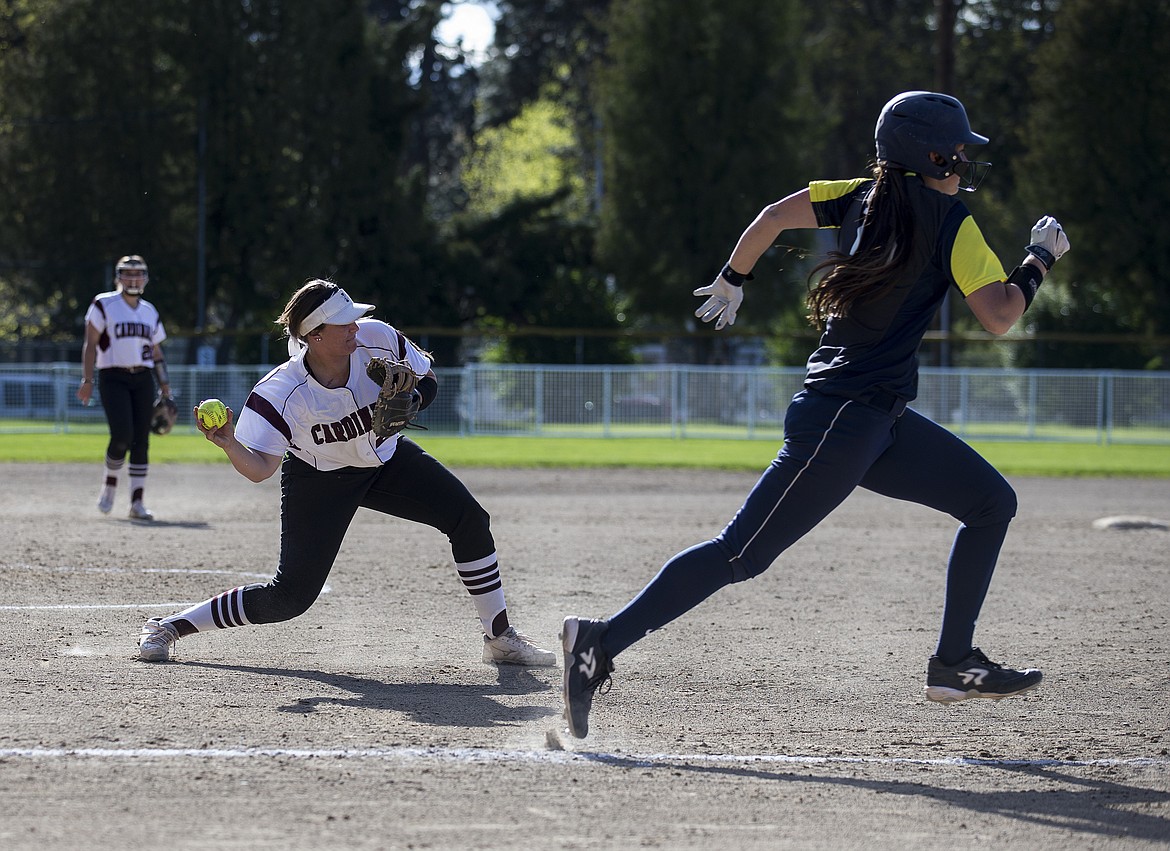 LOREN BENOIT/PressNorth Idaho College pitcher Kayla Moore fields a bunt and throws to first for the out in a game against College of Spokane on Wednesday at memorial Field.