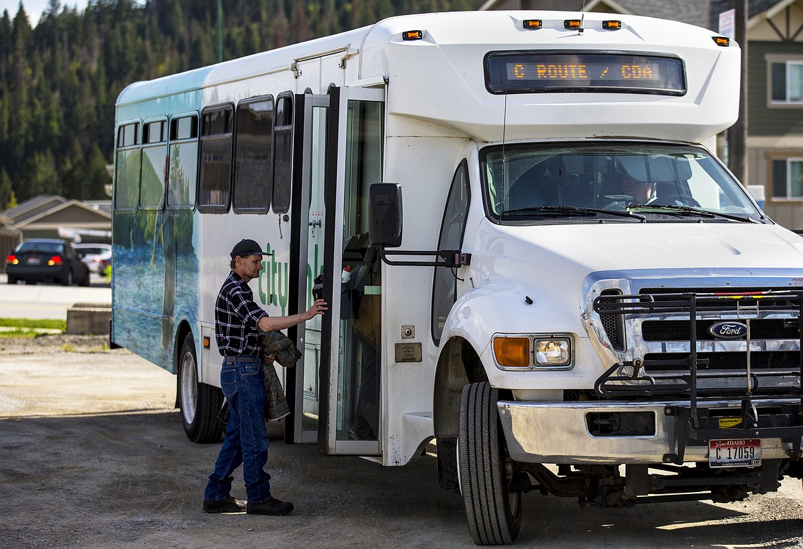 LOREN BENOIT/Press
Coeur d&#146;Alene resident Mike Harshaw boards the C Route Citylink bus Tuesday afternoon at the temporary transit center in Riverstone.
