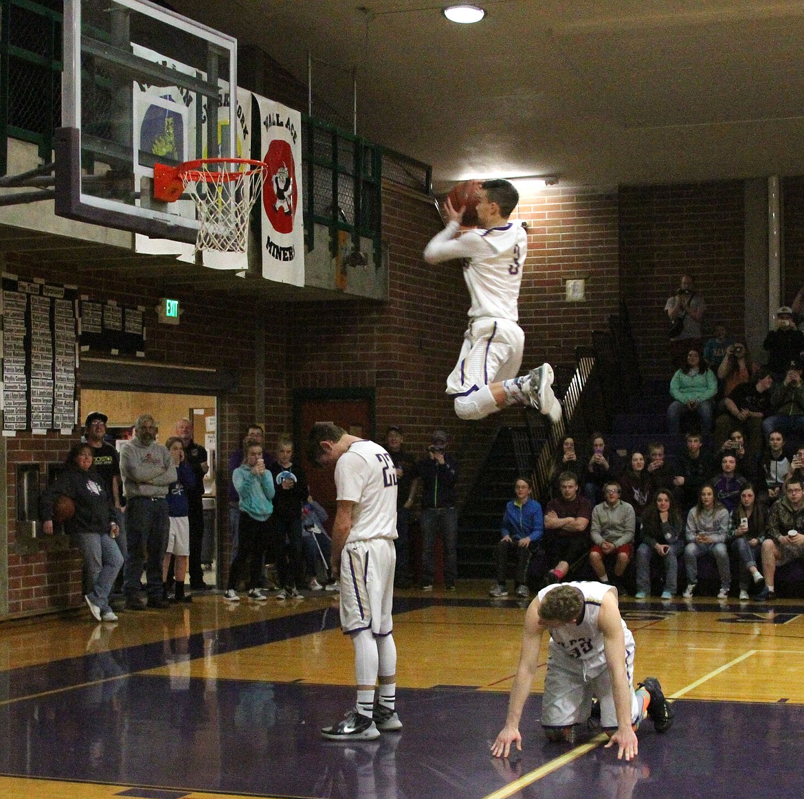 Photo by Josh McDonald.
Dunker Ryan Martian jumps over Dominic Easley (left) with the help of Caleb McDonald (right).