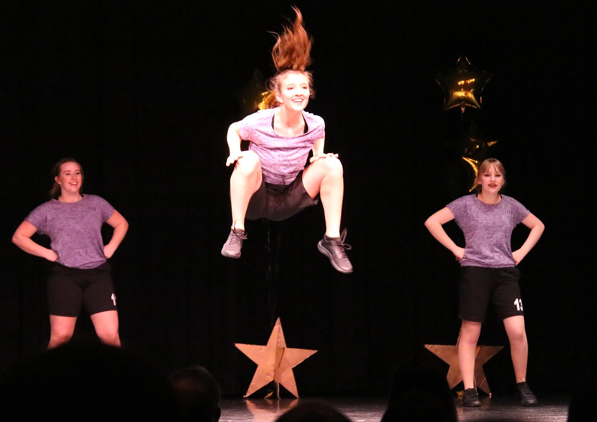 Photo by MANDI BATEMAN
Kianna Higgins reaches new heights during the Fitness portion of the program.