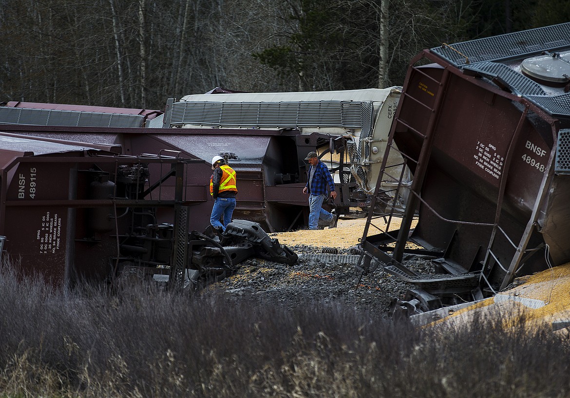 LOREN BENOIT/Press
Frank Zimmerman owner of Valley Vista Ranch and a BNSF employee walk the scene of a derailed train next to Zimmerman&#146;s property Monday morning south of Cocolalla in Bonner County.