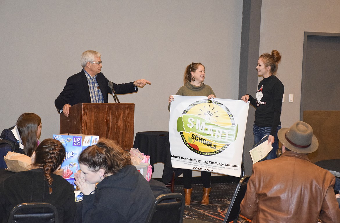 ARLEE HIGH School student Ashley Revis receives a SMART Schools award from Lt. Gov. Mike Cooney at the KwaTaqNuk Resort on April 24.