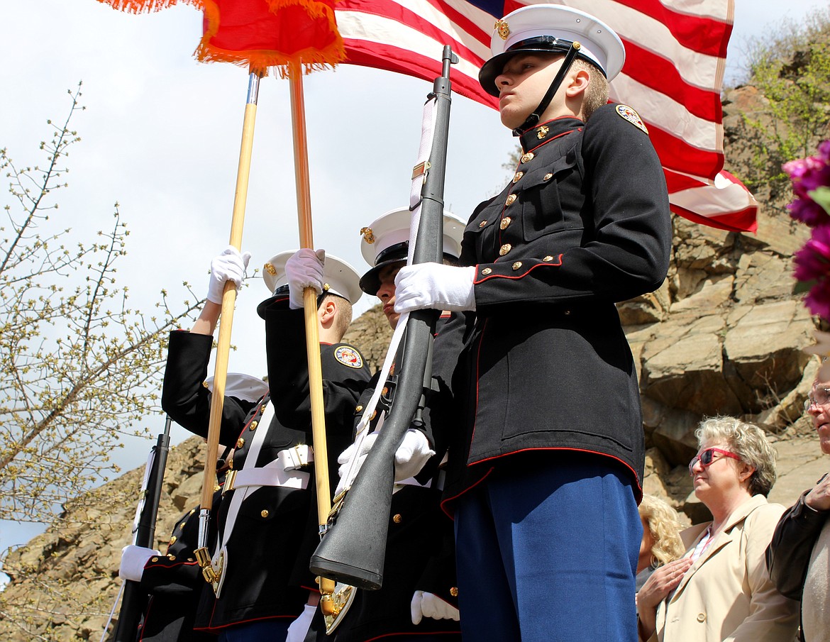 The Kellogg High School Marine Corps JROTC presents the colors.