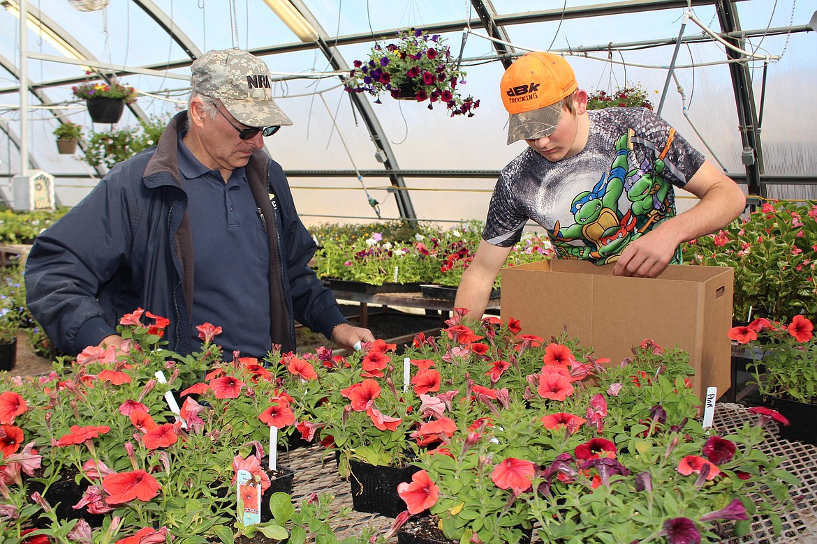 Cheryl Schweizer/Columbia Basin Herald
Customers had their choice of all the colors in the rainbow at the annual Moses Lake High School plant sale Friday.