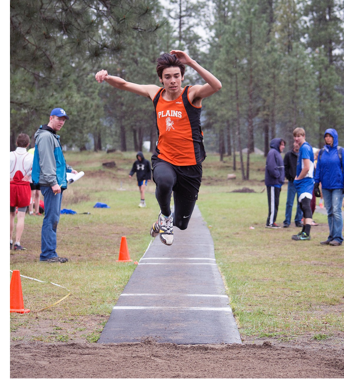 PLAINS TRACK runner Sinjin LeDeaux takes off in the triple jump in a recent track and field event. (Photos courtesy of Sandra Braun)