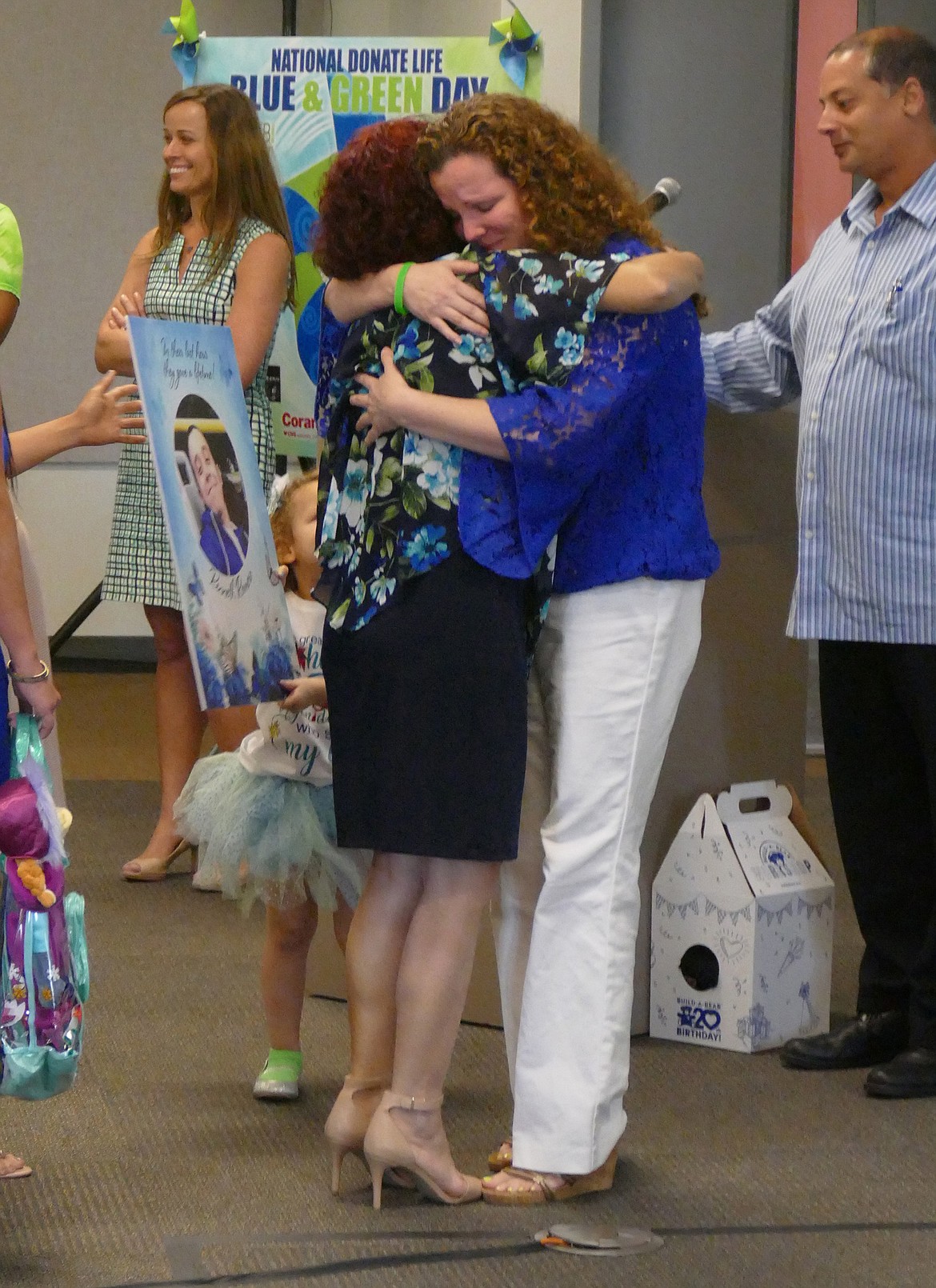 Emily Michot/Miami Herald - Heidi Anderson, right, embraces Maria Romero as the two meet for the first time since Romero's son provided a life-saving liver to Anderson's daughter.