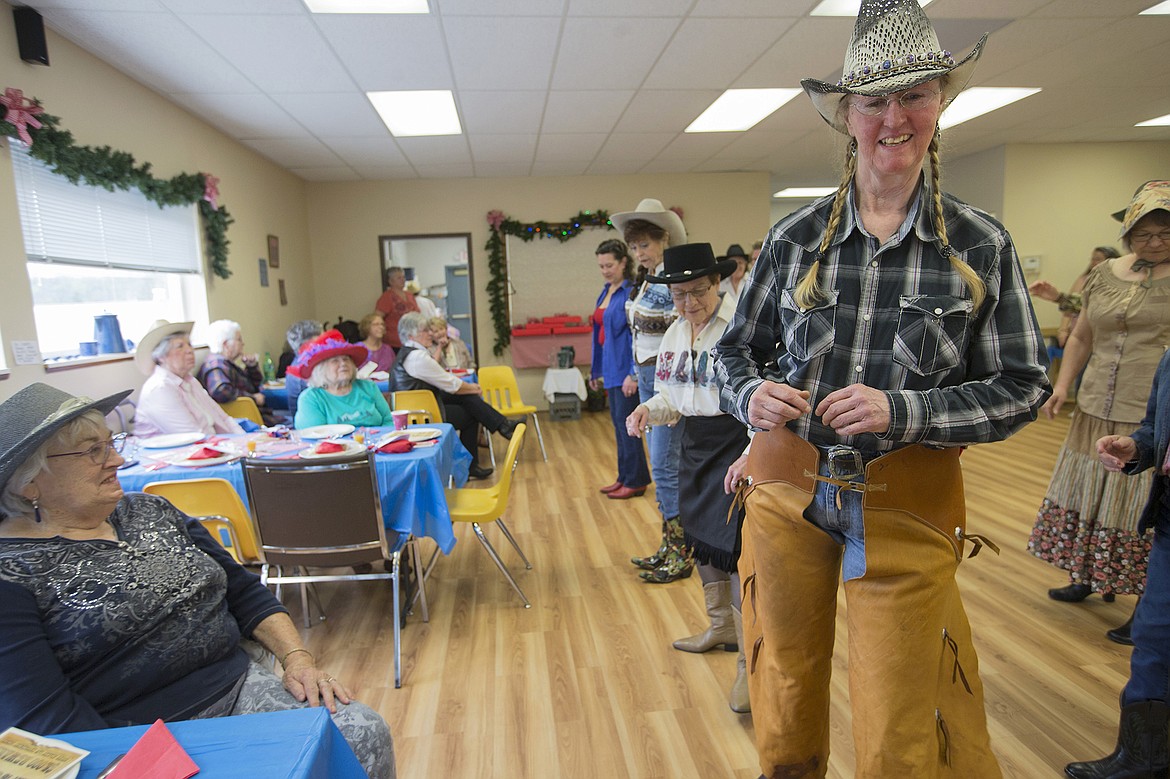 LISA JAMES/PressShirley McFaddan, right, and others line dance as fellow members of BAB (Bayview Athol Belmont) look on during their Wild West Social at the community center in Bayview on Tuesday