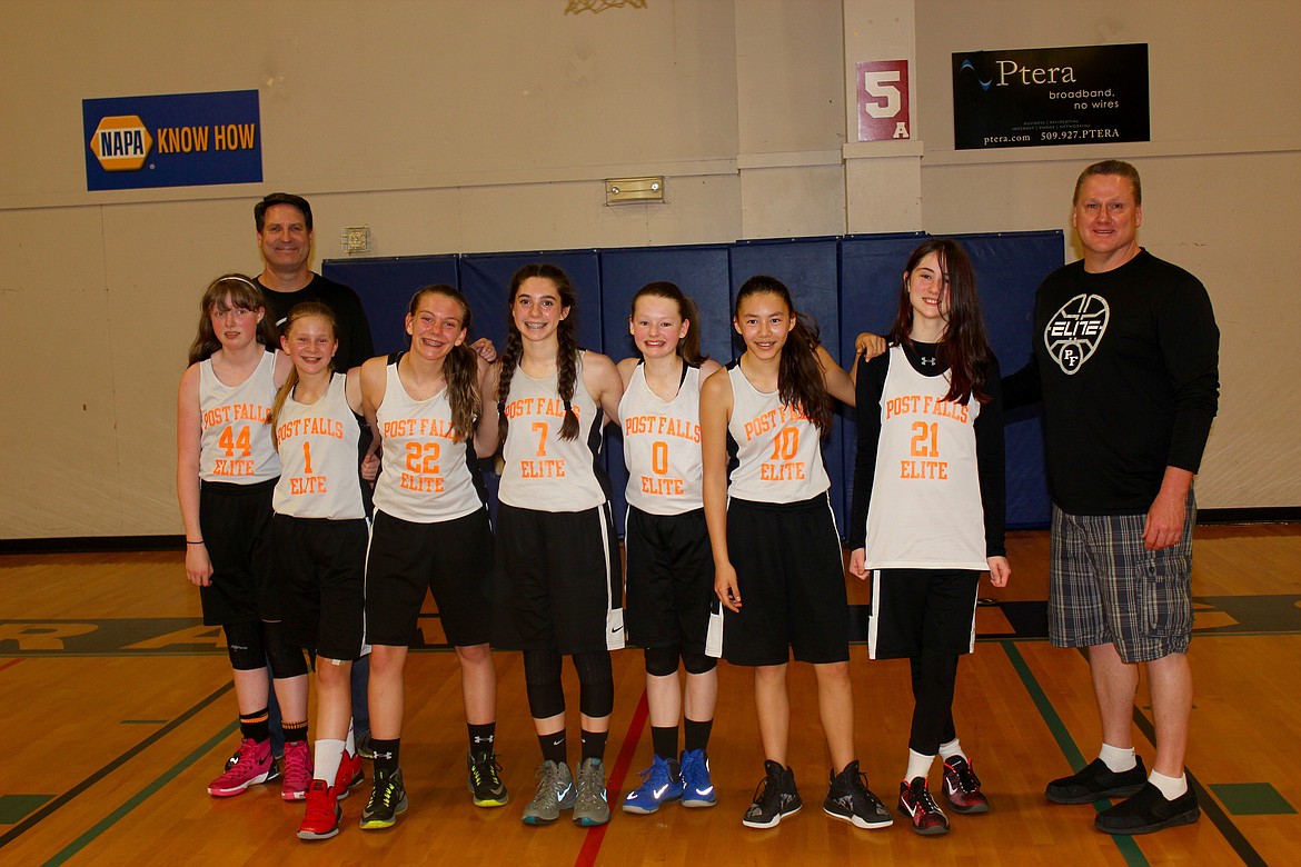 Courtesy photo
The Post Falls Elite Orange seventh-grade girls basketball team was champions of the sixth- and seventh-grade Spokane Y competitive league. The Orange finished the season with a 13-0 record. In the front from left are Hanna Christensen, Ashley Grant, Jadin Krier, Americus Crane, Mykah Kirking, Grace Couture Ishihara, Lizzy Owens and coach Bill Owens; and back row, coach Craig Christensen.