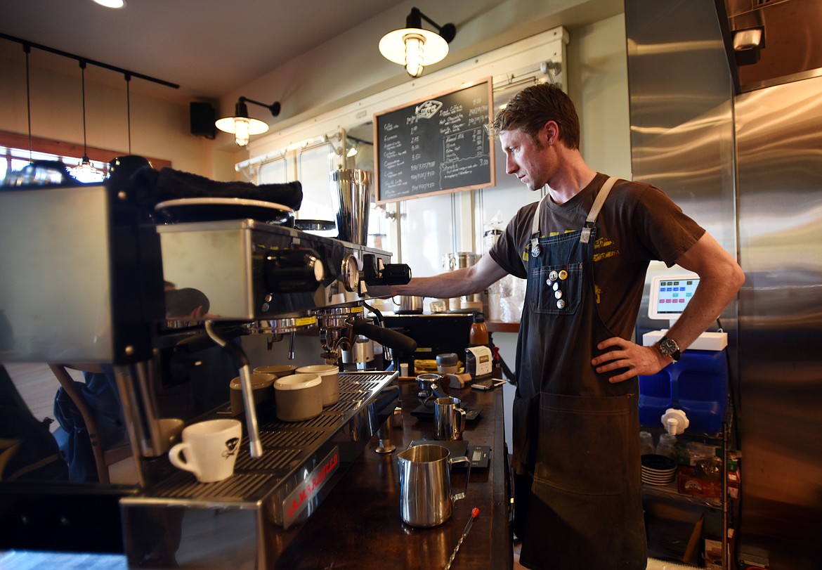 Matthew Bussard makes an espresso at the Azul Coffee Bar on May 11 inside the Uptown Hearth in Columbia Falls. His focus is not just on creating a good cup of coffee, but to create a great &#147;coffee experience.&#148; (Brenda Ahearn/Flathead Journal)