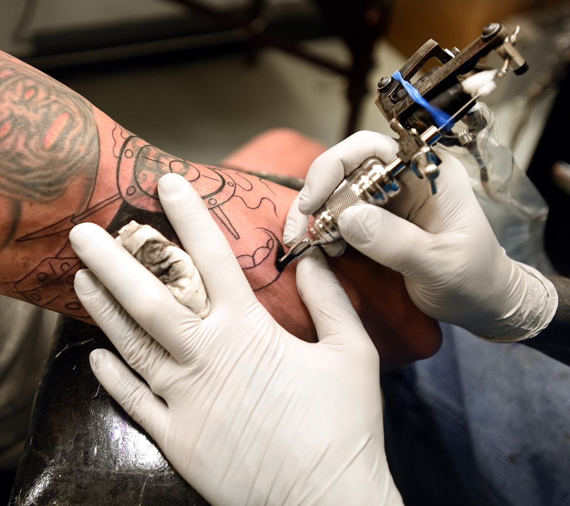 DARRYL TORGERSON working on a tattoo at Temple Decor in Kalispell.
(Brenda Ahearn/This Week in the Flathead)