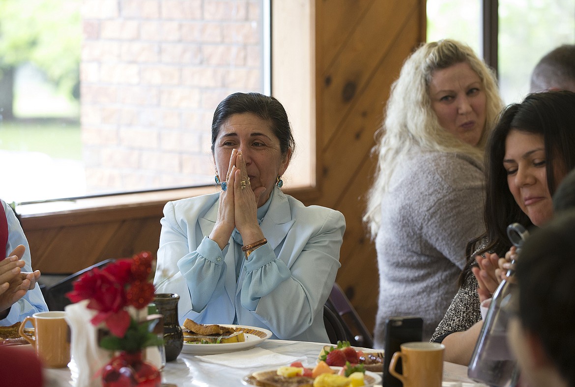 LISA JAMES/PressPatricia Garcia, a mother of three and a grandmother, as well as a devout Catholic, reacts to being named Mother of the year at St. Stanislaus Church's annual Mother's Day Breakfast on Sunday, following a mass celebrating the anniversary of Our Lady of Fatima.