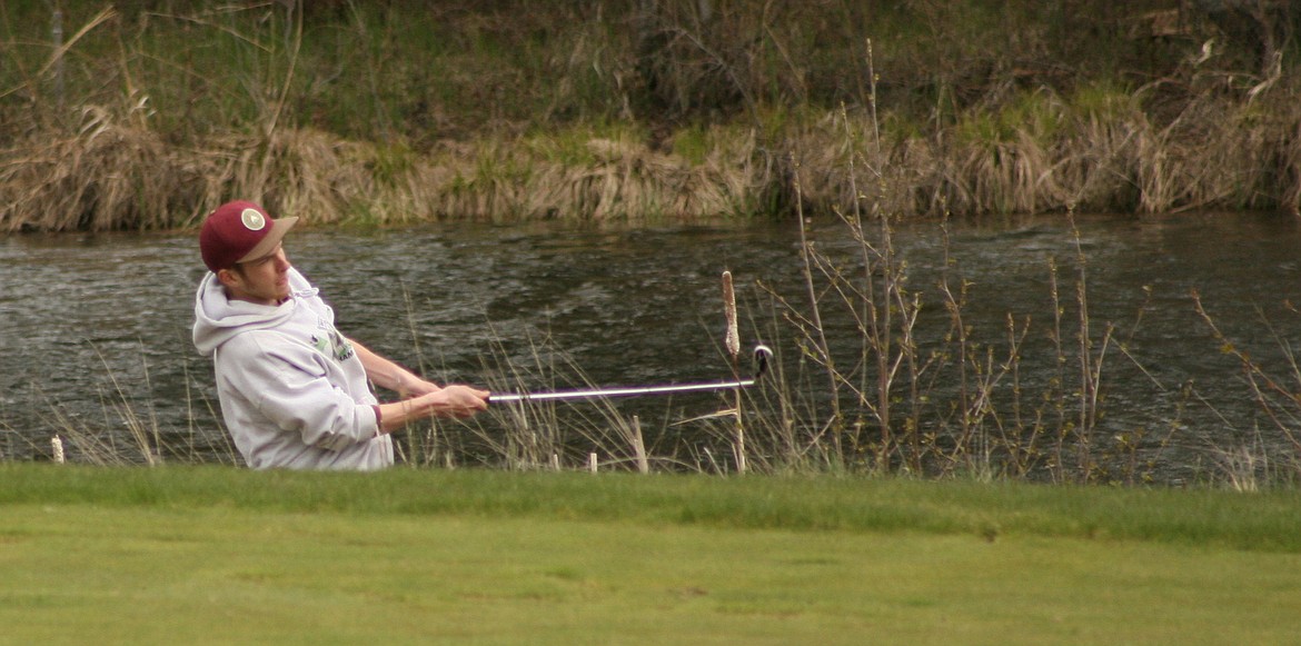 (PHOTO BY ERIC PLUMMER)
Damien Fitzpatrick, pictured earlier this season hitting in front of the Pack River at the Idaho Club, shot a 92 on Tuesday at the state golf tournament in Idaho Falls.