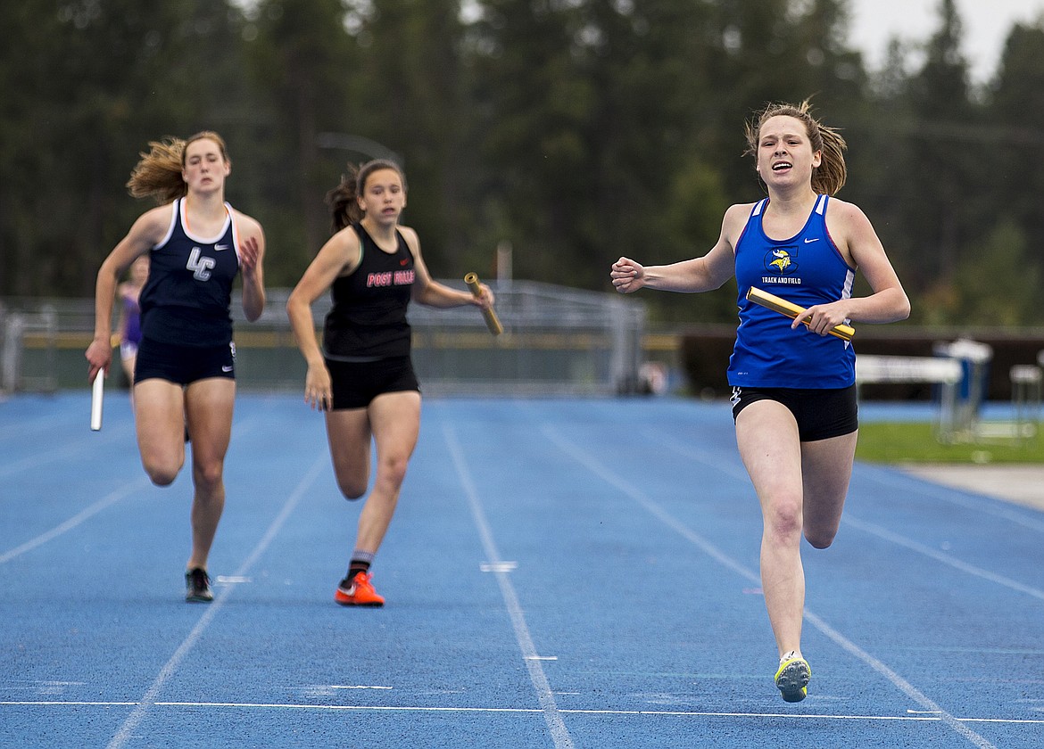 LOREN BENOIT/Press

Taryn Horvath of Coeur d&#146;Alene crosses the finish line of the 4 x 200 meter relay in first place at districts on Thursday at Coeur d&#146;Alene High School.