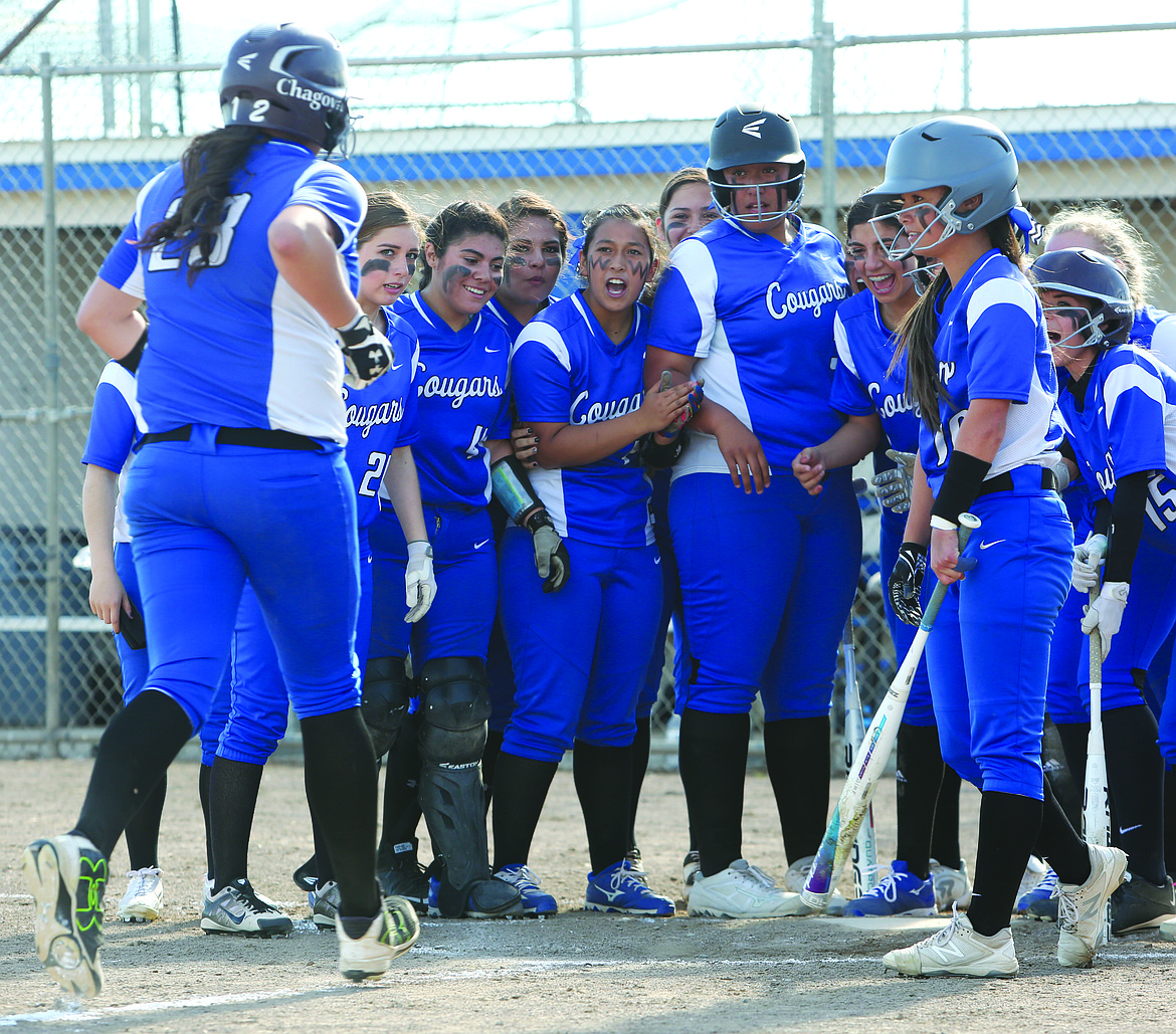 Connor Vanderweyst/Columbia Basin Herald
Jocelyn Chagoya's (23) teammates greet her at home plate after a home run in the third inning.