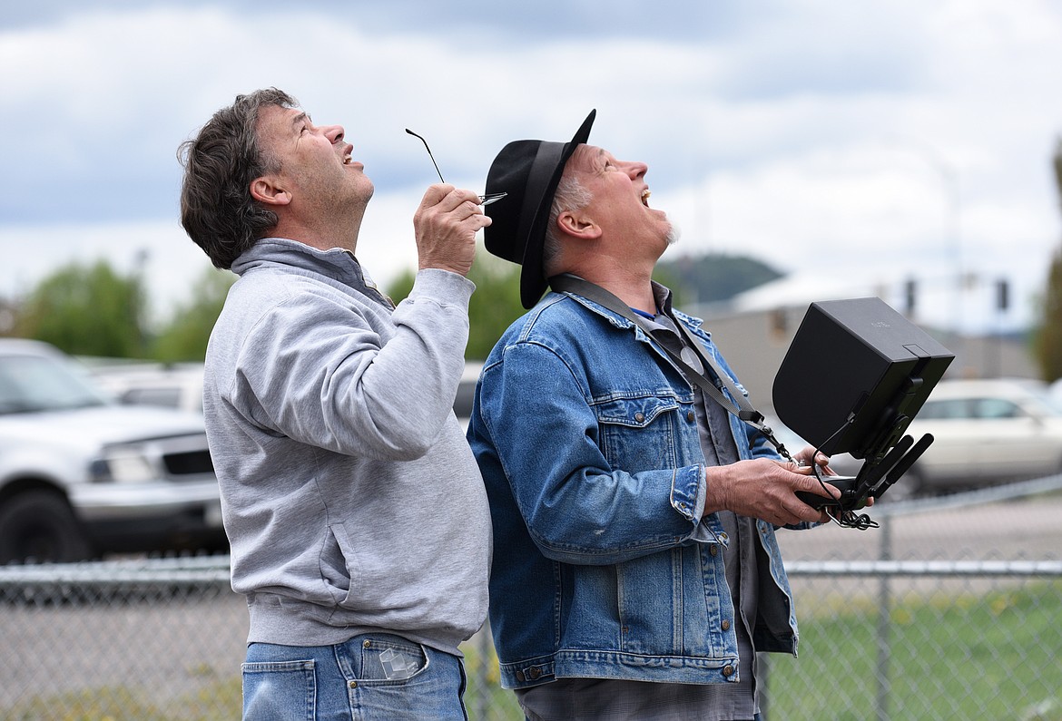 John Lowell, left, helps Mike Davenport fly an Autel Robotics Drone during the drone clinic at the Flathead County Fairgrounds on Saturday. (Aaric Bryan photos/Daily Inter Lake)