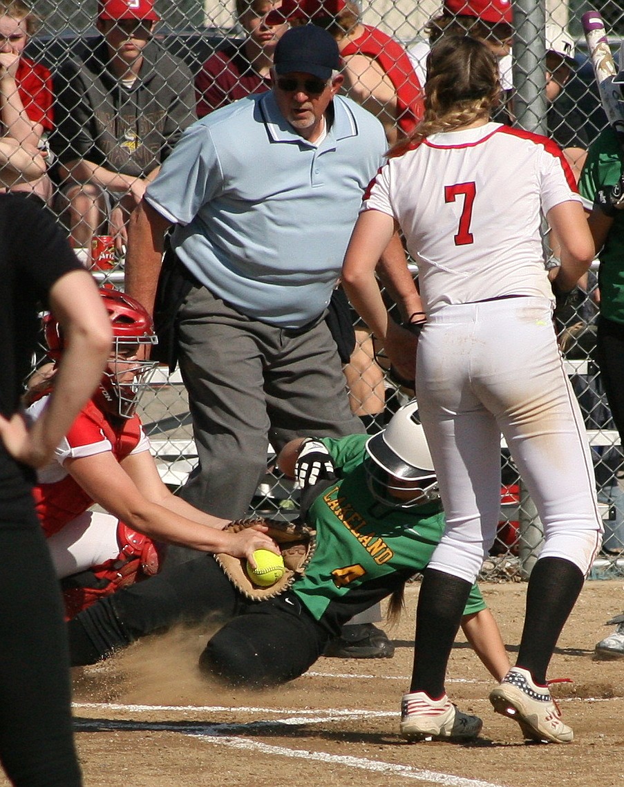 MaRynda Pehrson of Lakeland scores as part of the Hawks&#146; nine-run first inning in the 4A Region 1 softball championship game at Sandpoint.
ERIC PLUMMER/Bonner County Daily Bee