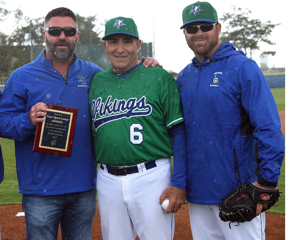 Rodney Harwood/Columbia Basin HeraldLongtime Moses Lake baseball coach Pete Doumit (6) coached his final game on Saturday at Big Bend Community College, wrapping up a 45-year career with a sweep over Blue Mountain. He was joined on the mound and B.J. Garbe and son Ryan Doumit.